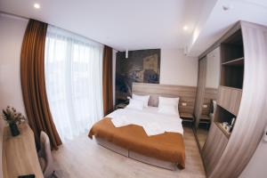 Postel nebo postele na pokoji v ubytování Hotel Verso