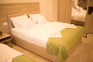 Postel nebo postele na pokoji v ubytování Hotel Verso