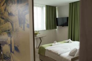 Postel nebo postele na pokoji v ubytování Hotel Verso