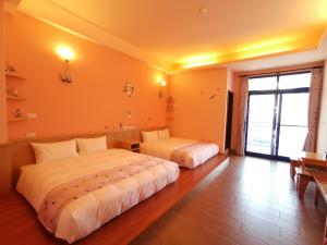 Giường trong phòng chung tại Love Ocean & Happy Bay HomeStay