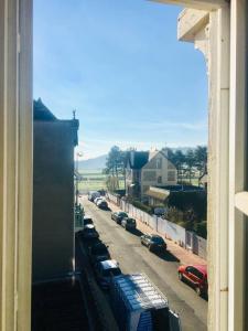 a view from a window of a street with parked cars at Appartement en plein centre de Deauville 2éme in Deauville