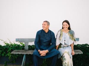 a man and a woman sitting on a bench at Relais & Châteaux Taubenkobel in Schützen am Gebirge