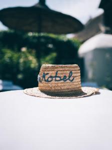 a straw hat sitting on top of a table at Relais & Ch&acirc;teaux Taubenkobel in Sch&uuml;tzen am Gebirge