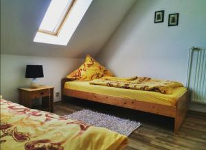 a bedroom with two beds and a window at Traumnest in Großheide