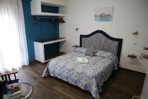 Postel nebo postele na pokoji v ubytování House SottoCoperta