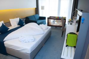 Posteľ alebo postele v izbe v ubytovaní Hotel Yacht Wellness & Business