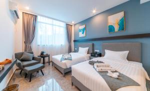 Postel nebo postele na pokoji v ubytování Bohol Panglao Begonia Resort