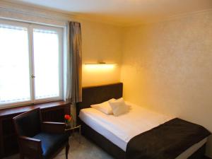 Postel nebo postele na pokoji v ubytování Boutiquehotel Oberkirch im Zentrum