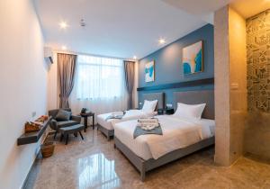 Postel nebo postele na pokoji v ubytování Bohol Panglao Begonia Resort
