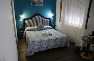 Postel nebo postele na pokoji v ubytování House SottoCoperta