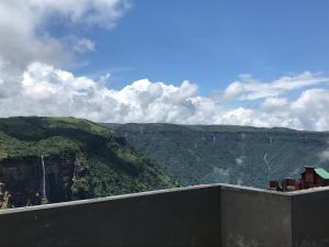 a view of the mountains from the top of a building at Aisha Guest House Bed & Breakfast in Cherrapunji