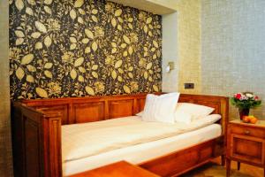 Postel nebo postele na pokoji v ubytování Boutiquehotel Oberkirch im Zentrum