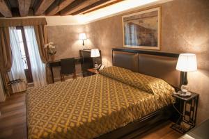 Postel nebo postele na pokoji v ubytování EGO' Residence Venice