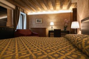 Postel nebo postele na pokoji v ubytování EGO' Residence Venice