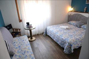 Postel nebo postele na pokoji v ubytování House SottoCoperta