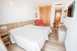 Postel nebo postele na pokoji v ubytování Hotel Montemar