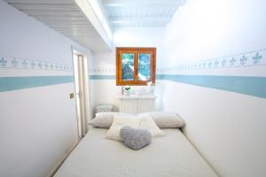 Кровать или кровати в номере La casa dei cigni sul lago d’Orta