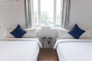 Una cama o camas en una habitación de HELLO Make Yourself at Home