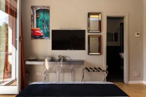 A television and/or entertainment centre at Top Floor Trastevere