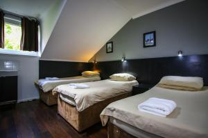 Ένα ή περισσότερα κρεβάτια σε δωμάτιο στο Charing Cross Hotel