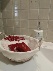 a bathroom sink with a bowl of soap and a toothbrush at APARTAMENTO L AÜT in Pla de l'Ermita