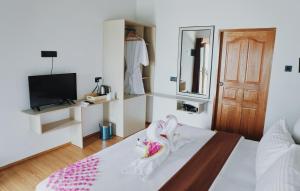Postel nebo postele na pokoji v ubytování Club Kaafu Maldives + 30 fotografií