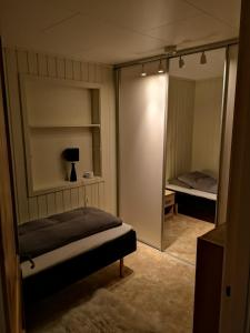 Una cama o camas en una habitación de House in the heart of the Lyngen Alps with Best view
