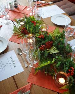 a wooden table with a christmas centerpiece on it at Tranøya in Tranøya
