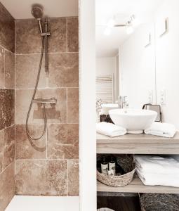 a bathroom with a shower and a sink at Au Coeur De La Ville in Honfleur +36 photos