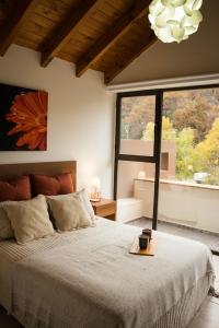 מיטה או מיטות בחדר ב-Departamento San Martin de los Andes Centrico y Moderno