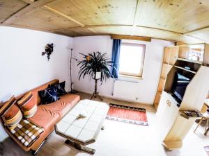 a living room with a couch and a table at Haus Bergblick in Prägraten