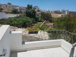 a balcony with a view of a garden at Dar is-Sliem in Tarxien