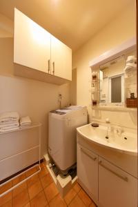 a bathroom with a sink and a toilet and a sink at Stay SAKURA Nihonbashi / Vacation STAY 51029 in Osaka