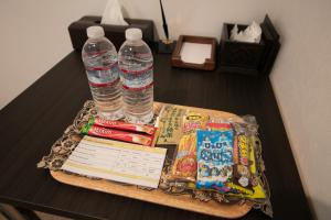 a tray with books and water bottles on a table at Stay SAKURA Nihonbashi / Vacation STAY 51029 in Osaka