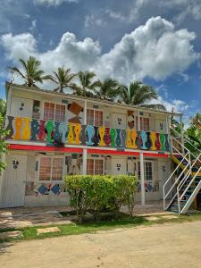 a building with a colorful banner on the side of it at Posada Donde Pilo Avila in San Andrés