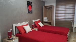 A bed or beds in a room at Notti Rosa B&B