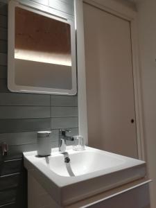 a bathroom with a white sink and a mirror at Hotel Rural Aguazul in Covanera +46 photos