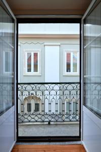 a view through a glass door of a building at Renovated and Spacious Duplex Apartment With Patio, By TimeCooler in Lisbon
