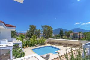 a swimming pool in the backyard of a house at Villa Ekin in Fethiye
