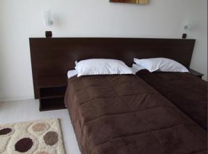 
Un pat sau paturi într-o cameră la PLAISIR
