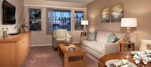 a living room with a couch and a table at La Jolla Riviera Inn in San Diego