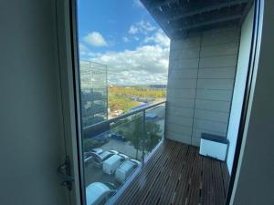 an office balcony with a view of a parking lot at Central Milton Keynes hub one bedroom secured apartment in Milton Keynes