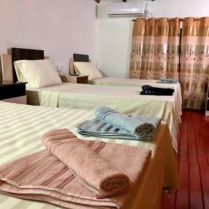 Säng eller sängar i ett rum på Adhara Apart