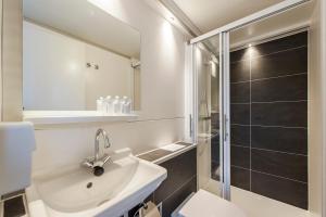 a bathroom with a sink and a shower at Tiny floating house, Mallorca in Maastricht