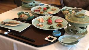 a table with plates of food on top of it at Tsumugi in Hakone