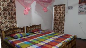 En eller flere senge i et værelse på DERO BEACH HOLIDAY HOME
