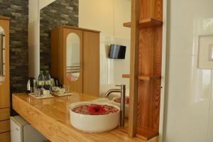 a kitchen counter with a bowl on top of it at Palm Garden in Thoddoo