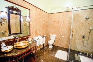 a bathroom with a sink and a shower and a toilet at The Grand Imperial - Heritage Hotel in Agra