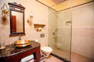 a bathroom with a sink and a shower and a toilet at The Grand Imperial - Heritage Hotel in Agra