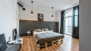 Posteľ alebo postele v izbe v ubytovaní Sereno Apartments